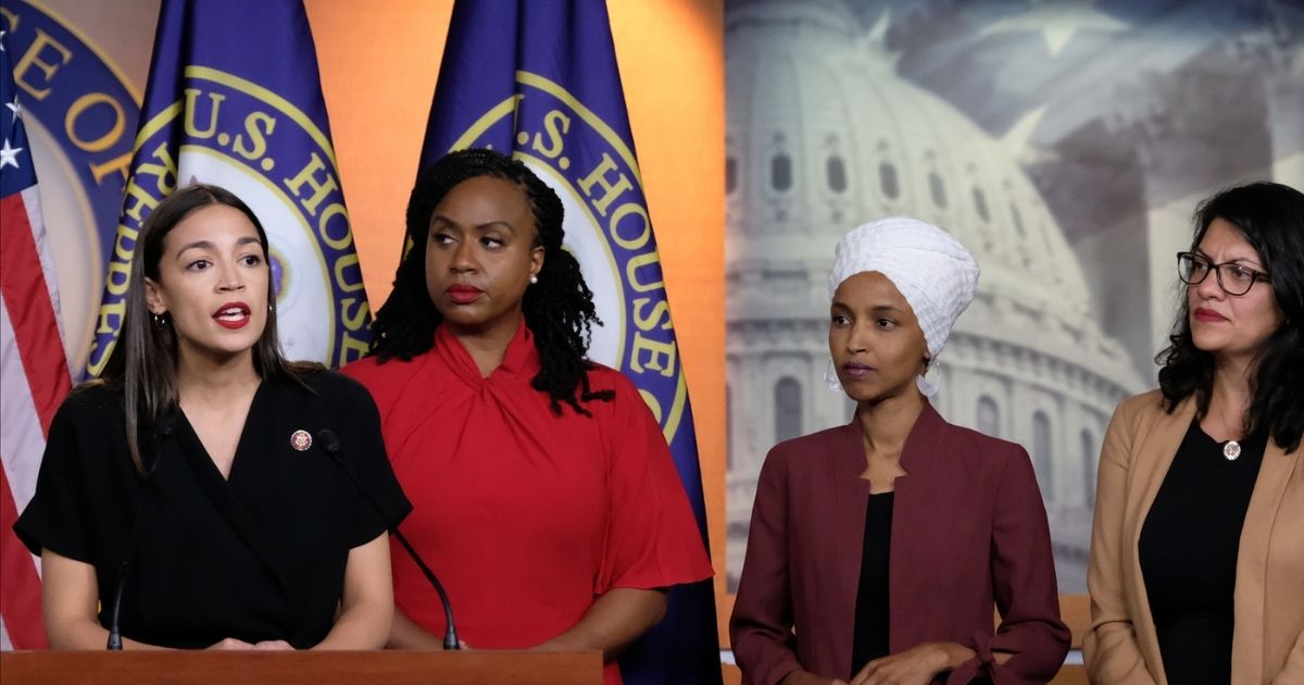 Rep. Alexandria Ocasio-Cortez speaks as Reps. Ayanna Pressley, Ilhan Omar, and Rashida Tlaib listen during a news conference at the U.S. Capitol in Washington on July 15, 2019.