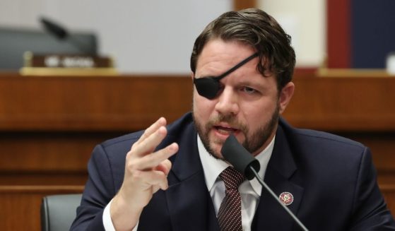 Texas Republican Rep. Dan Crenshaw questions witnesses during a House Homeland Security Committee on Capitol Hill in Washington on Sept. 17, 2020.
