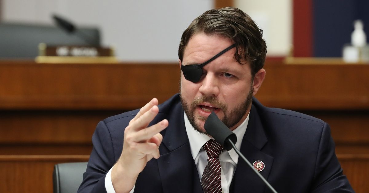 Texas Republican Rep. Dan Crenshaw questions witnesses during a House Homeland Security Committee on Capitol Hill in Washington on Sept. 17, 2020.