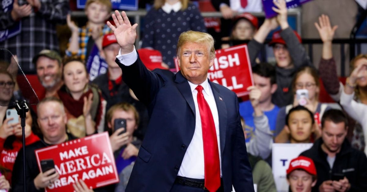 Then-President Donald Trump arrives at a campaign rally for Republican Senate candidate Mike Braun at the County War Memorial Coliseum in Fort Wayne, Indiana, on Nov. 5, 2018.