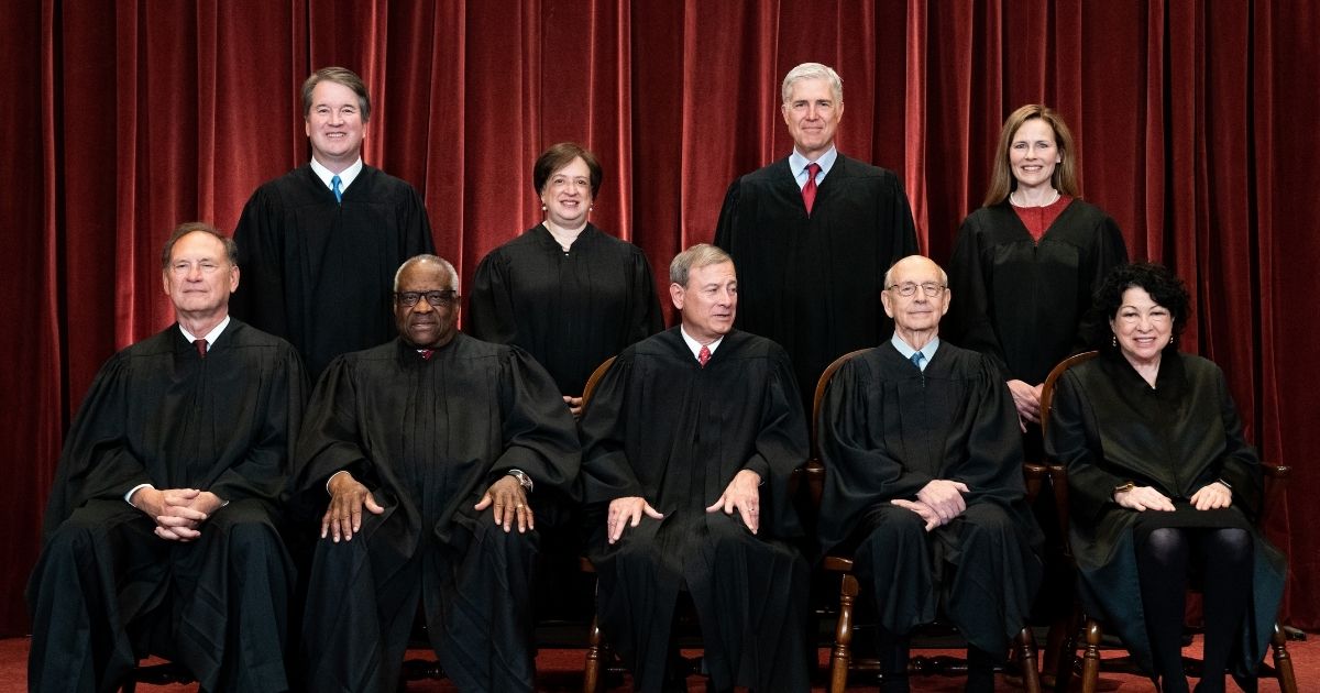 Supreme Court Justices pose for a photo at the Supreme Court in Washington, D.C., on April 23, 2021.