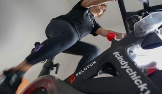 Peloton user Cindy Cicchinelli is seen exercising at her home in Pittsburgh, Pennsylvania, in a photo taken on Sunday.