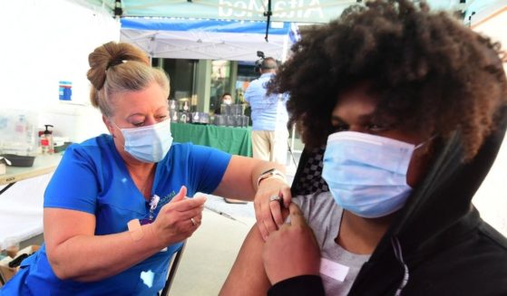 Registered Nurse Amy Berecz-Ortega from AltaMed Health Services administers the Covid-19 vaccine in Los Angeles, California on Tuesday.