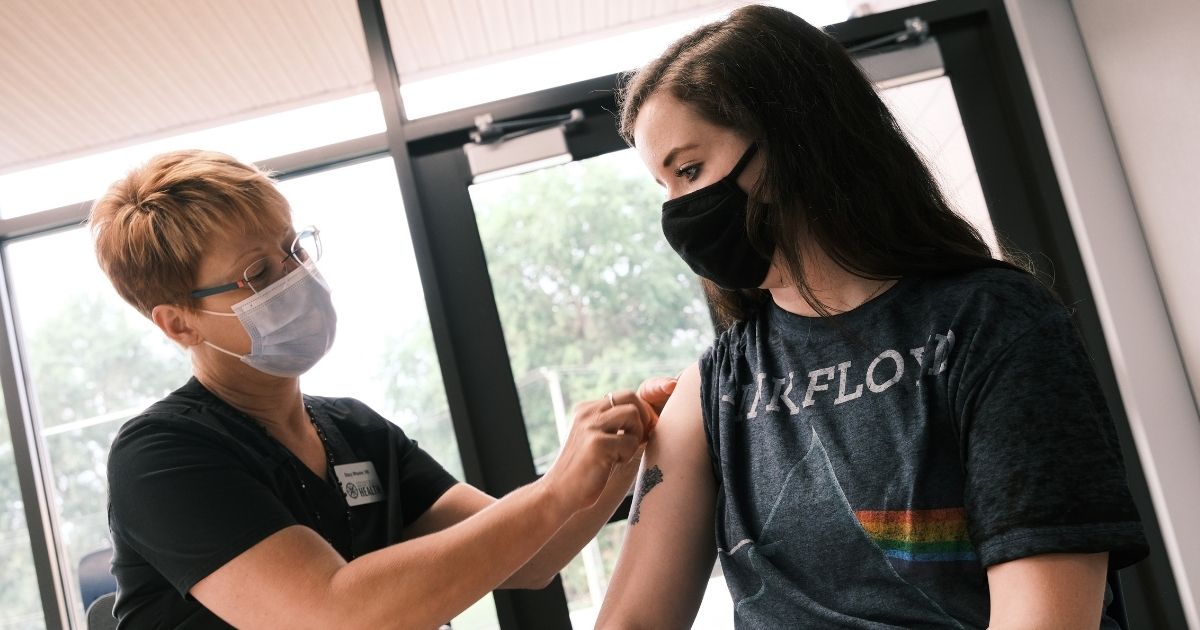Rachel Steury receives a COVID-19 vaccine at a clinic in Springfield, Missouri, on Aug. 5.