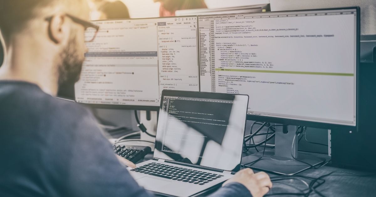 A web developer is pictured working at his computer in the stock image above.