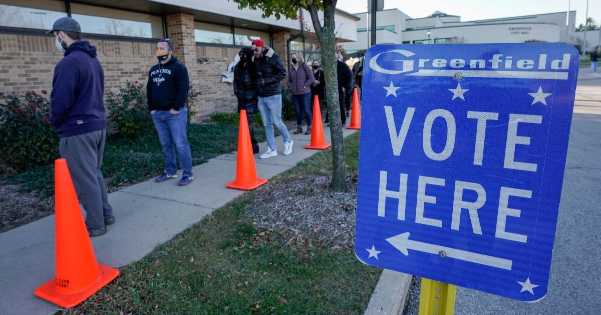 People line up to vote outside the Greenfield Community Center in the Milwaukee suburb of Greenfield, Wisconsin, on Nov. 3, 2020.