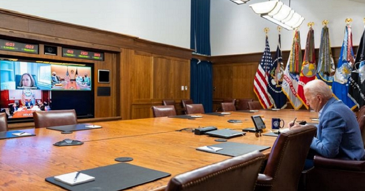 President Joe Biden meets with top administration officials by teleconference in a photo released by the White House on Saturday.