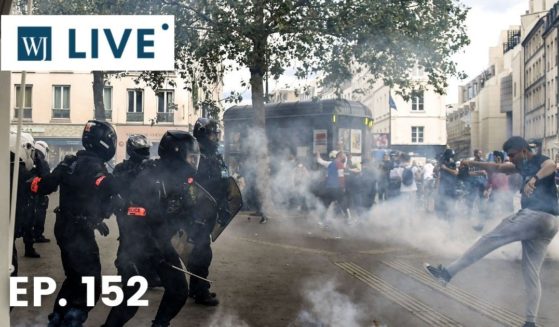 Demonstrators clash with anti-criminality (BAC) and BRAV police brigades at the end of a demonstration as part of a national day of protest against French legislation making a COVID-19 health pass compulsory to visit a cafe, board a plane or travel on an inter-city train in Paris on July 31, 2021.