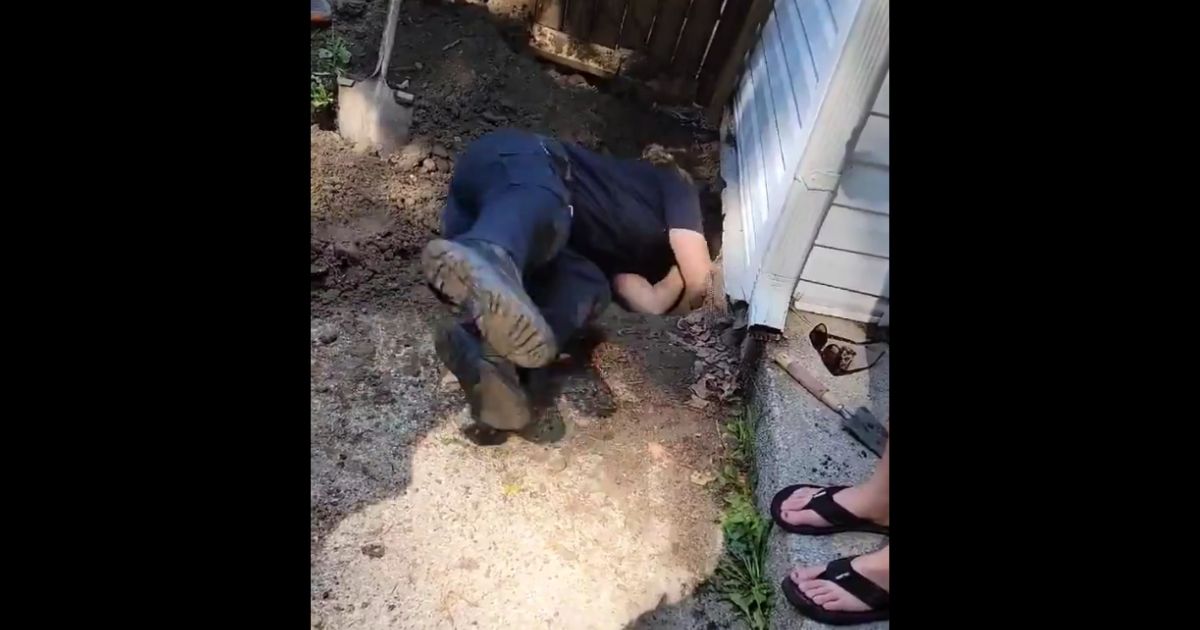 Officer Rave with the West Seneca Police rescues a dog that ended up under a house.