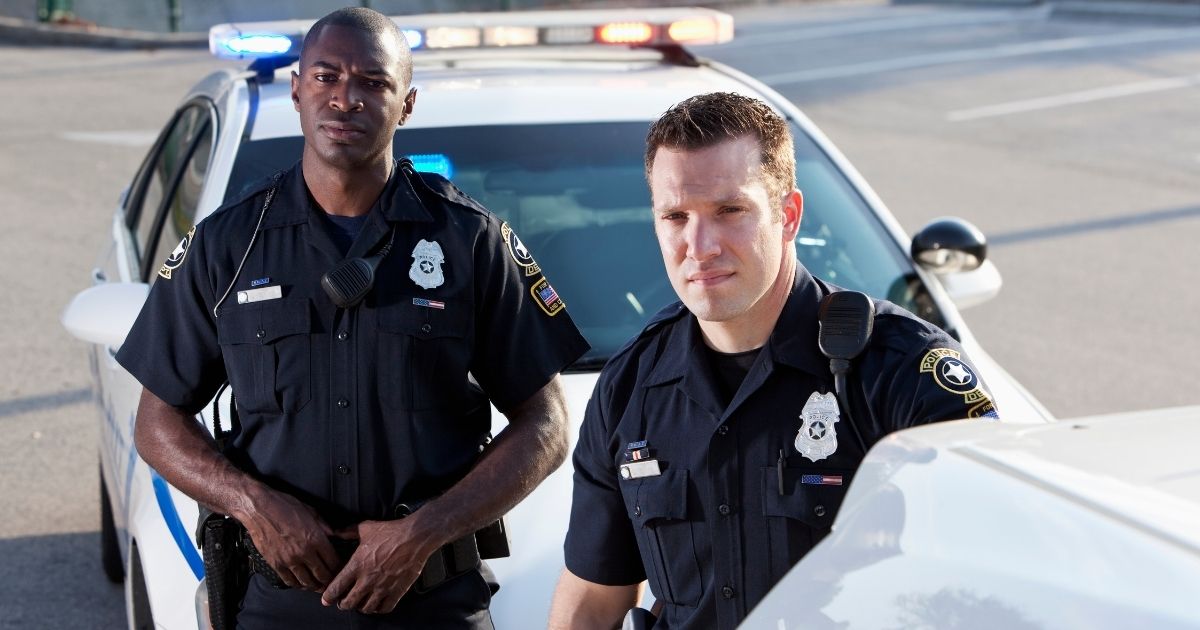 Police officers are seen in the above stock image.