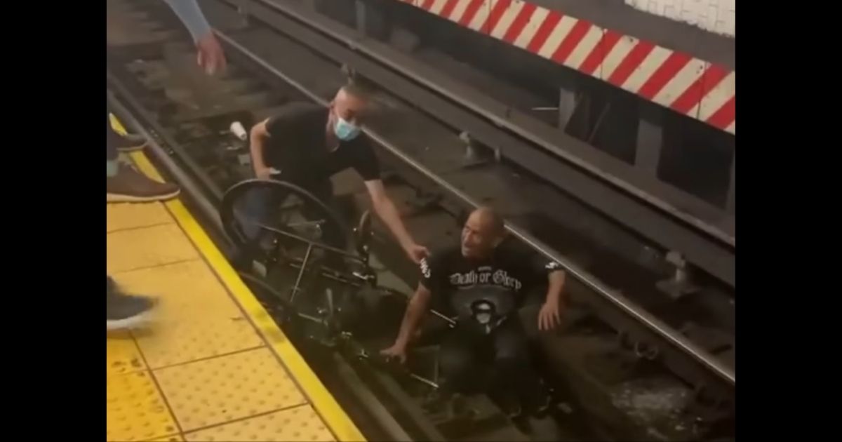 A good Samaritan helps a man who fell onto the subway tracks at Union Station in New York City.