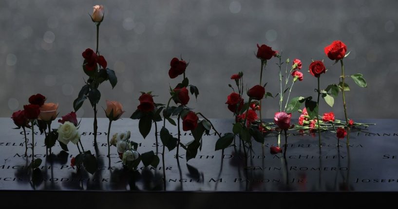 Flowers are placed into the inscribed names of the victims of the 9/11 attacks and in the 1993 World Trade Center bombing during the annual commemoration ceremony at the National 9/11 Memorial and Museum on Sept. 11, 2021 in New York City.