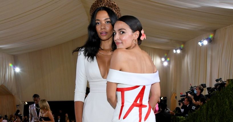 Fashion designer Aurora James, left, and Democratic New York Rep. Alexandria Ocasio-Cortez pose for photos at the Met Gala at the Metropolitan Museum of Art in New York City on Monday.