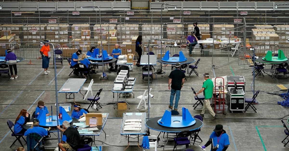 Maricopa County ballots cast in the 2020 general election are examined and recounted by contractors working for Florida-based company, Cyber Ninjas, on Thursday, May 6, 2021 at Veterans Memorial Coliseum in Phoenix.