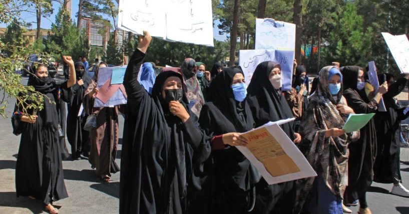 Afghan women hold placards as they take part in a protest in Herat on Thursday.