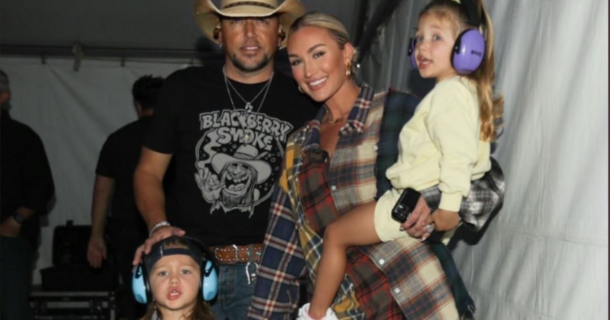 Jason Aldean, his wife Brittany, and their two children, Memphis and Navy, pose together before his concert in California on Sunday.