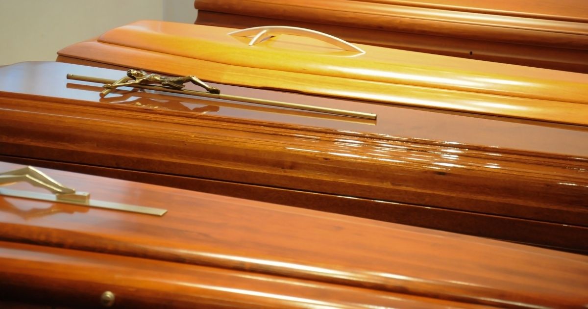 This stock image portrays a line of caskets in a funeral home. The audit of the 2020 election in Arizona reportedly found there were several hundred potential ballots counted from dead voters.