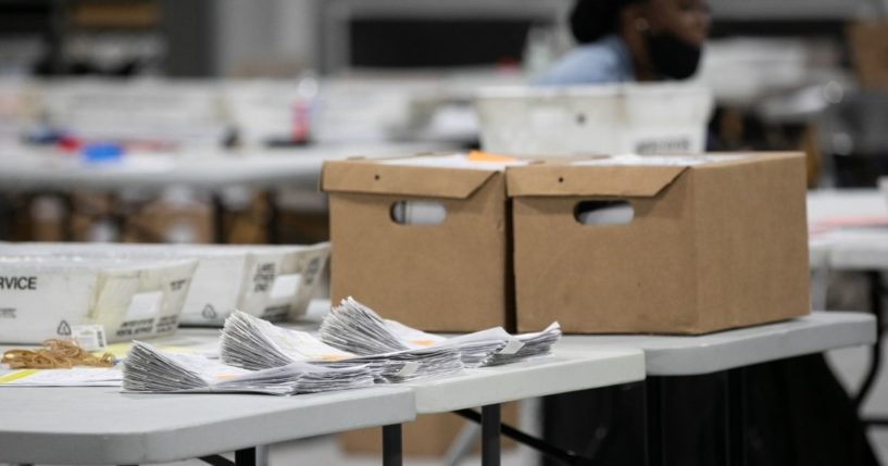 A stack of ballots is in the process of being counted at the Gwinnett Voter Registrations and Elections office on Nov. 6, 2020, in Lawrenceville, Georgia.
