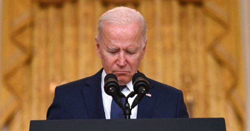 President Joe Biden pauses as he delivers remarks on the terror attack at Hamid Karzai International Airport in the East Room of the White House, Washington, D.C. on August 26, 2021.