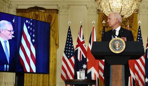 President Joe Biden, right, looks toward Australian Prime Minister Scott Morrison during a virtual news conference in the East Room of the White House in Washington on Wednesday.
