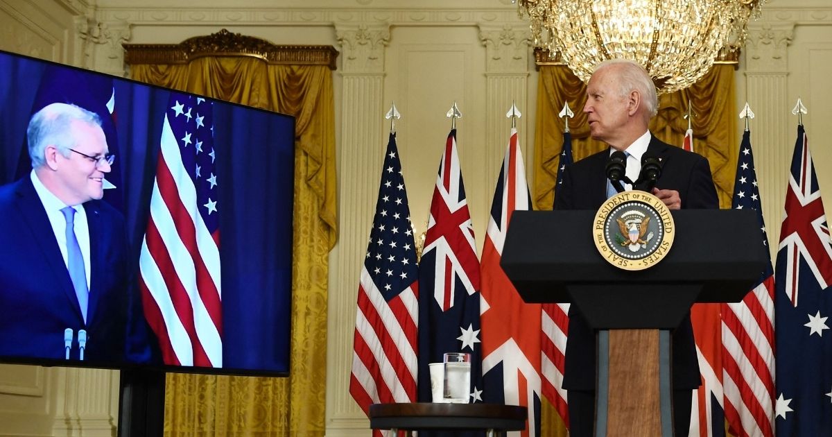 President Joe Biden, right, looks toward Australian Prime Minister Scott Morrison during a virtual news conference in the East Room of the White House in Washington on Wednesday.