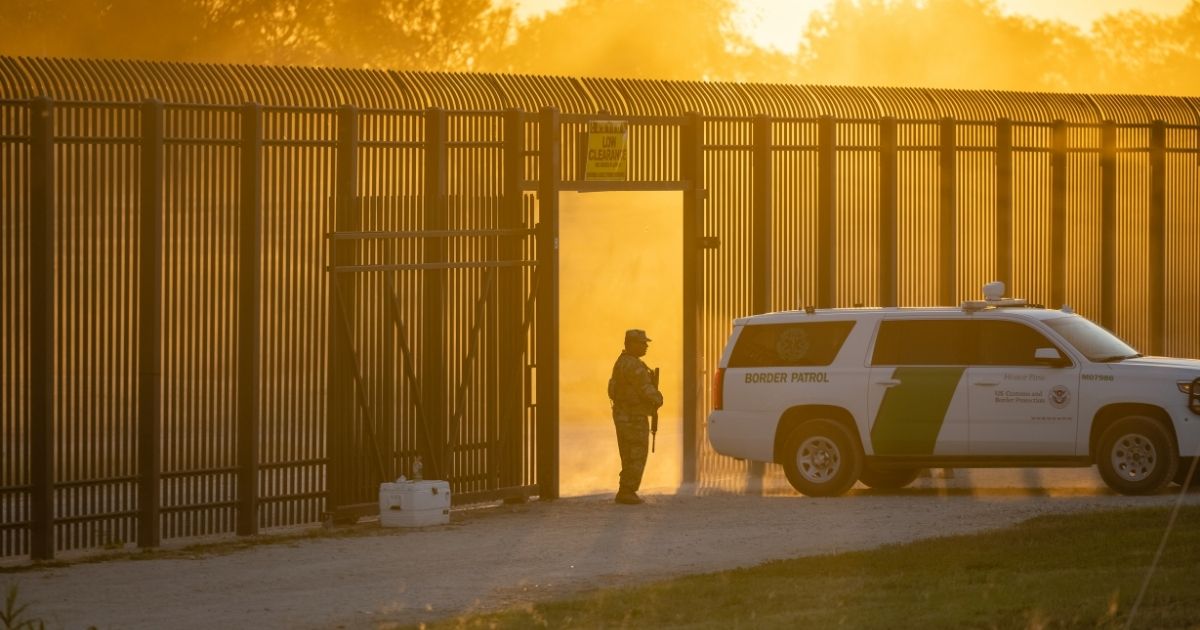 A Border Patrol vehicle drives through a gate in the border fence after U.S. Customs and Border Protection closed the point of entry between the U.S. and Mexico in response to an influx of migrants on Sept. 17, 2021, in Del Rio, Texas.