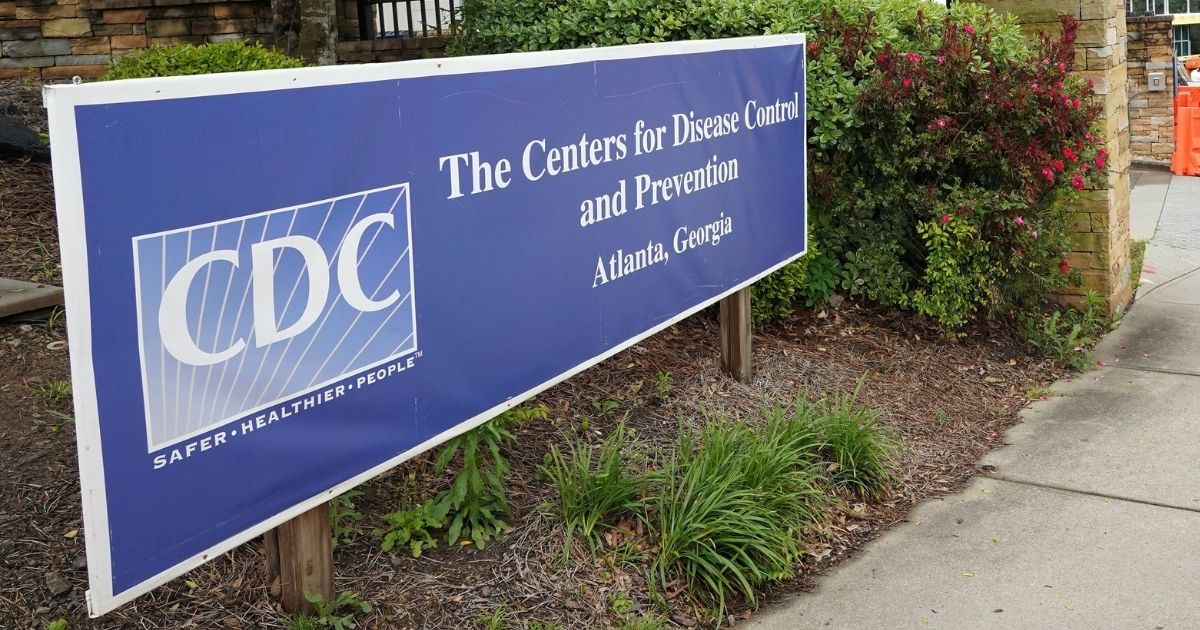 A sign is seen by the entrance of the Centers for Disease Control and Prevention in Atlanta on April 23, 2020.