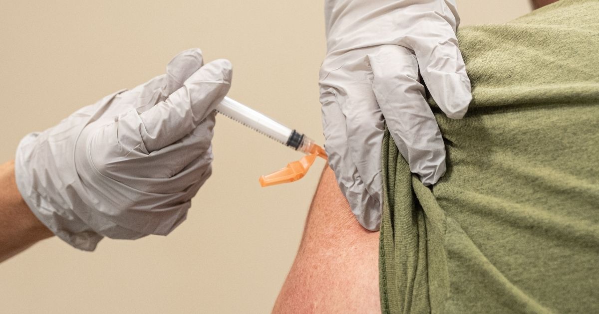 A civilian contractor receives his COVID-19 vaccine from Preventative Medicine Services on Sept. 9, 2021, in Fort Knox, Kentucky.