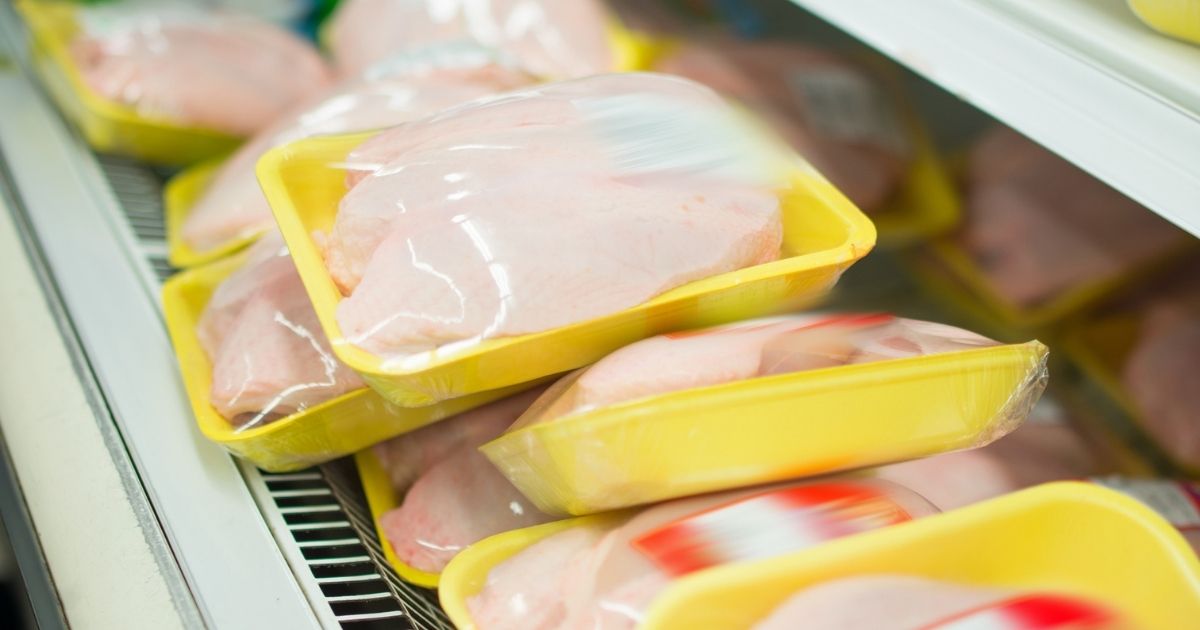 Packaged chicken breasts are pictured at a grocery store in the stock image above.