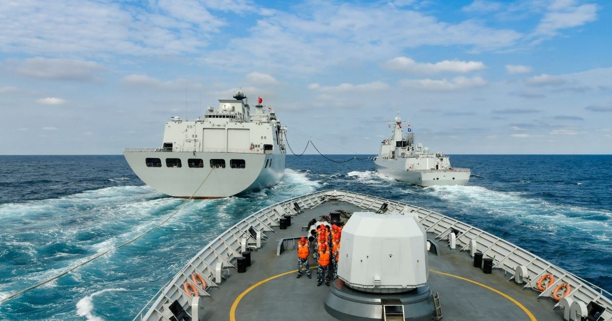 Warships attached to a Chinese navy destroyer flotilla perform replenishment-at-sea during a four-day combat training exercise in the South China Sea.