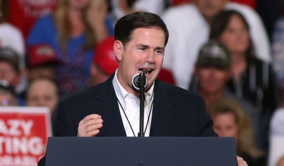 Arizona Gov. Doug Ducey speaks during a rally for then-President Donald Trump at the International Air Response facility on Oct. 19, 2018, in Mesa, Arizona.