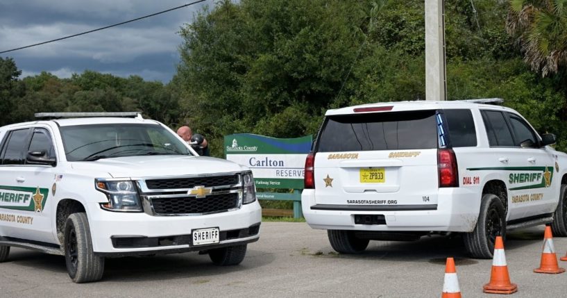 Sarasota County Sheriff's Office vehicles sit at the the entrance of the Carlton Reserve during a search for Brian Laundrie on Tuesday in Venice, Florida. Laundrie is a person of interest in the death of his girlfriend, Gabby Petito.