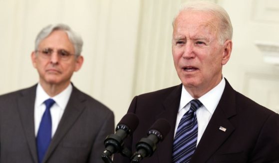 President Joe Biden, joined Attorney General Merrick Garland, left, speaks at the White House in Washington on June 23.