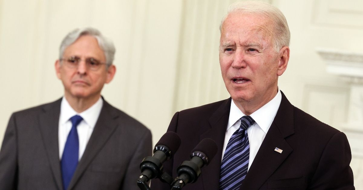 President Joe Biden, joined Attorney General Merrick Garland, left, speaks at the White House in Washington on June 23.