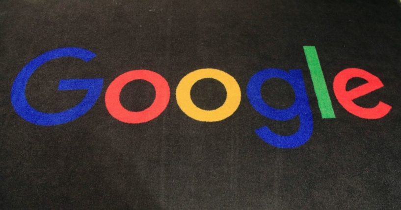 The logo of Google is displayed on a carpet at the entrance hall of Google France in Paris.