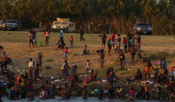 Haitian migrants are pictured on the banks of the Rio Grande in Del Rio, Texas, as seen from Ciudad Acuna, Coahuila state, Mexico, on Monday.