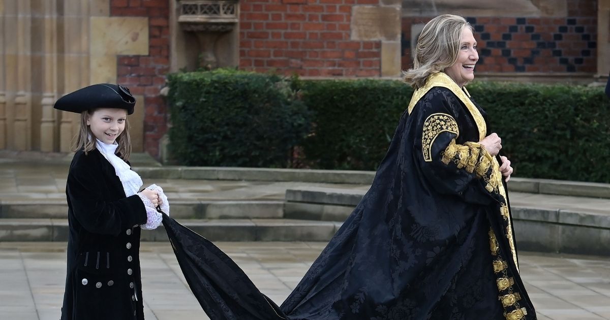 Former Secretary of State Hillary Clinton takes part in an official procession at Queens University on Friday in Belfast, Northern Ireland.
