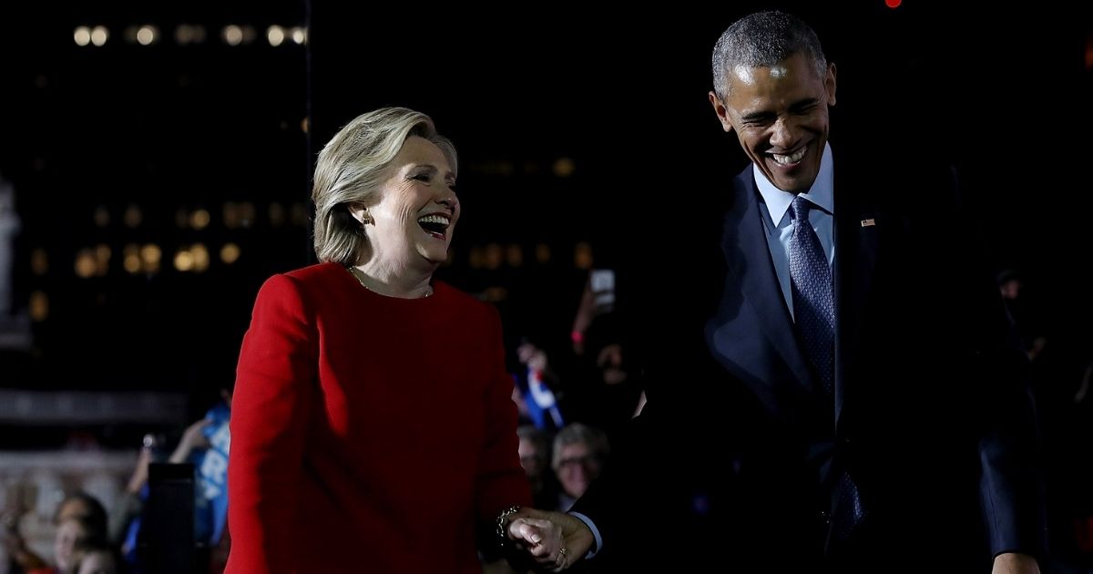 Then-President Barack Obama and former Secretary of State Hillary Clinton embrace during a campaign rally on Independence Mall on Nov. 7, 2016, in Philadelphia.