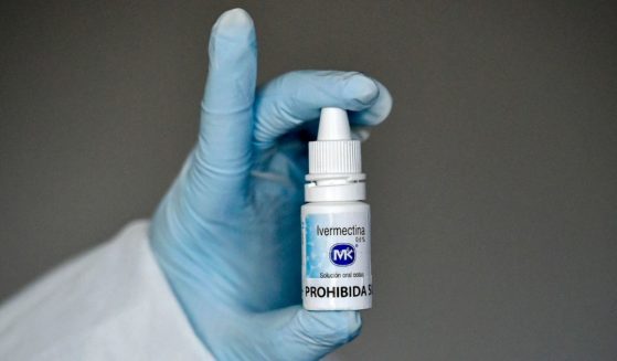 A health worker shows a bottle of Ivermectin, a medicine authorized by the National Institute for Food and Drug Surveillance to treat patients with mild, asymptomatic or suspicious COVID-19, as part of a study of the Center for Paediatric Infectious Diseases Studies, in Cali, Colombia, on July 21, 2020.