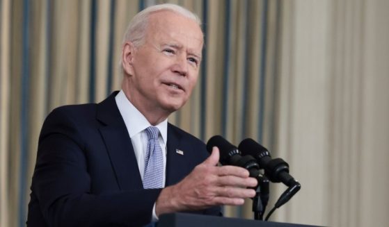 President Joe Biden gestures as he delivers remarks on his administration’s COVID-19 response and vaccination program at the White House on Friday.