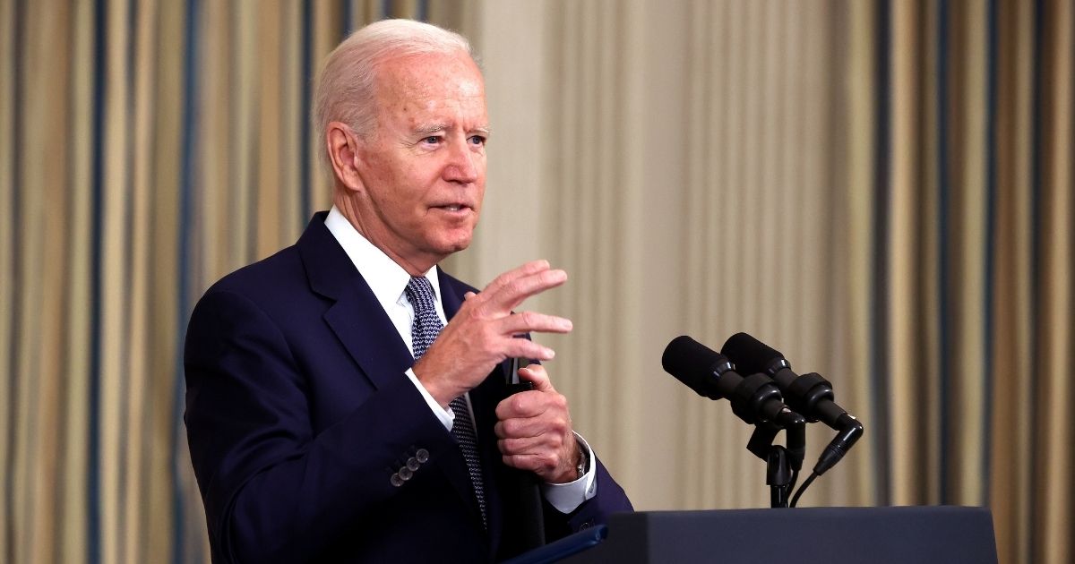 President Joe Biden delivers remarks in the State Dining Room at the White House on Friday in Washington, D.C.
