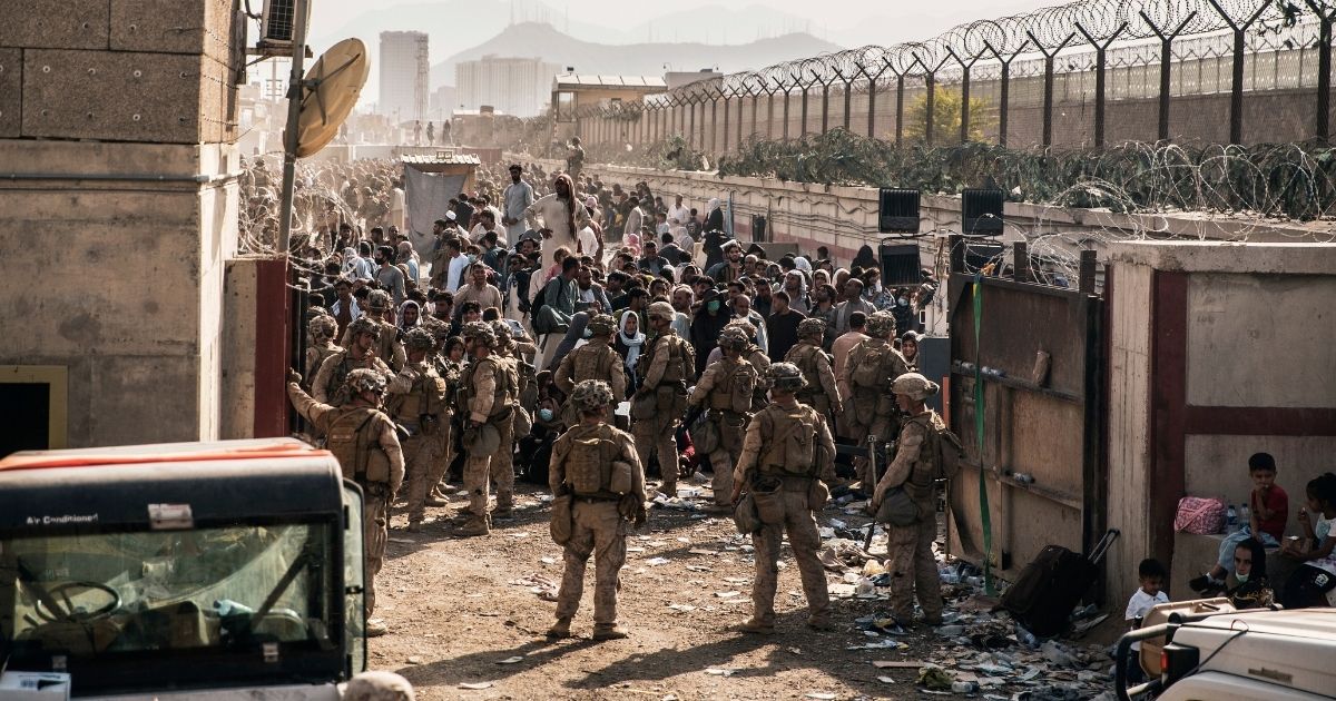 U.S. Marines stand guard at a checkpoint during the evacuation at Hamid Karzai International Airport in Kabul, Afghanistan, on Aug. 21.