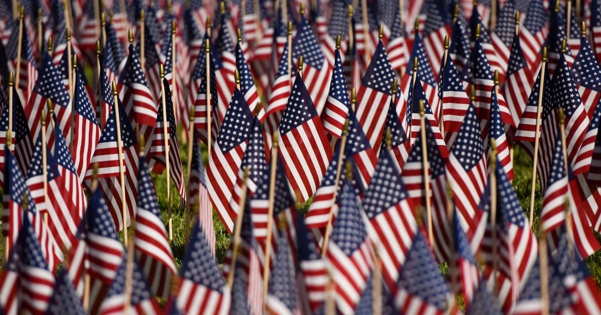 A field of 2,977 flags honoring those who died on Sept.11, 2001, is displayed during a 9/11 memorial at the Nixon Presidential Library and Museum in Yorba Linda, California, on Saturday.
