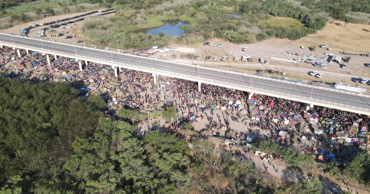 Thousands of migrants are seen in a camp under the international bridge in Del Rio, Texas.