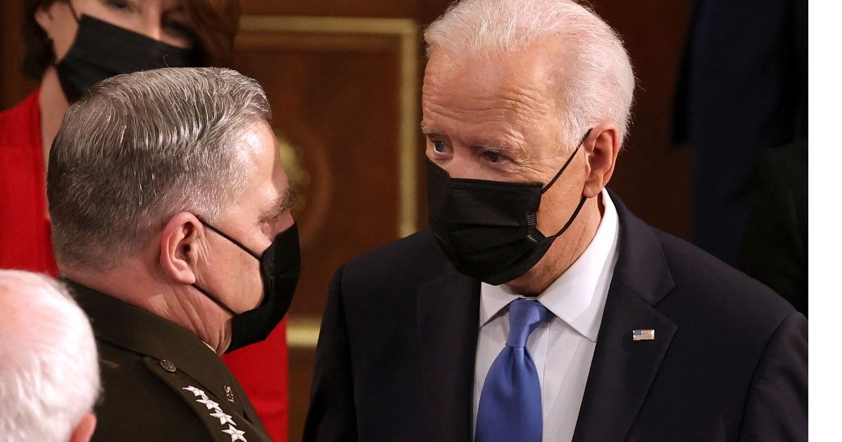 President Joe Biden, right, speaks with Gen. Mark A. Milley, chairman of the Joint Chiefs of Staff, at the US Capitol on April 28, 2021.