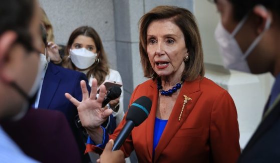 Speaker of the House Nancy Pelosi talks with reporters after departing a House Democratic whip meeting in the basement of the U.S. Capitol on Wednesday.