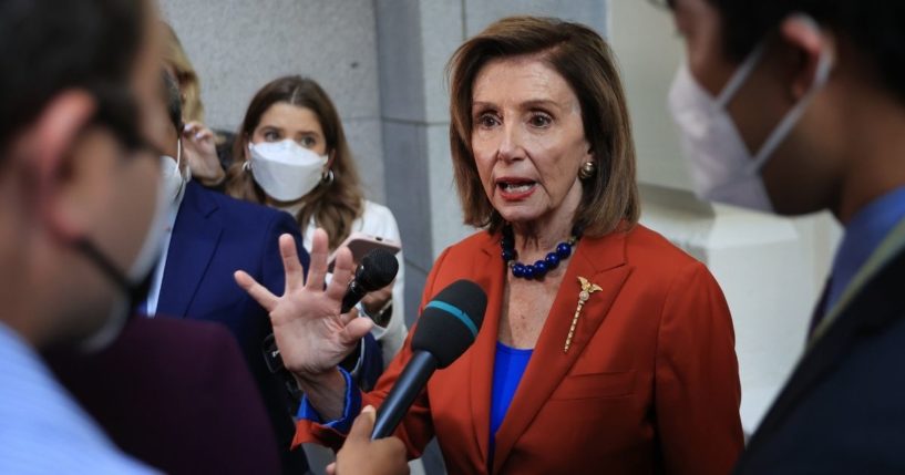 Speaker of the House Nancy Pelosi talks with reporters after departing a House Democratic whip meeting in the basement of the U.S. Capitol on Wednesday.
