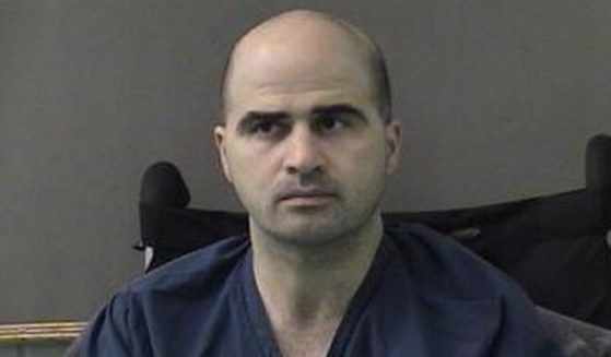In this photo released by the Bell County Sheriff's Office, U.S. Maj. Nidal Hasan, the Army psychiatrist who was charged with murder in the Fort Hood shootings, is seen in a booking photo after being moved to the Bell County Jail on April 9, 2010, in Belton, Texas.