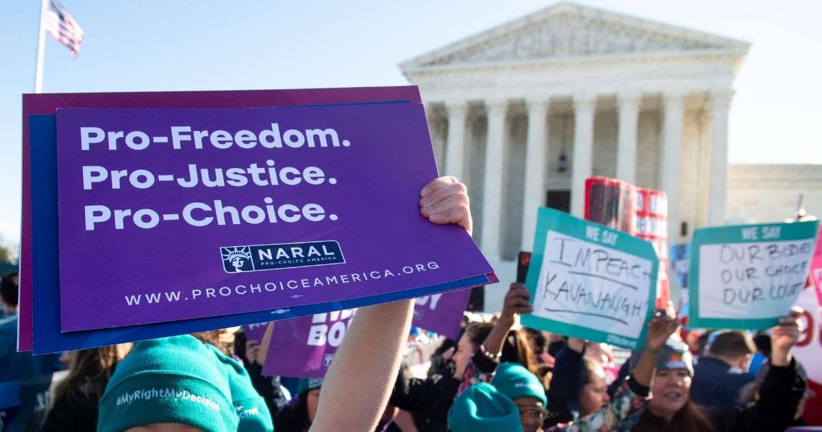 Pro-choice activists protest during a demonstration outside the U.S. Supreme Court in Washington, D.C., on March 4, 2020.
