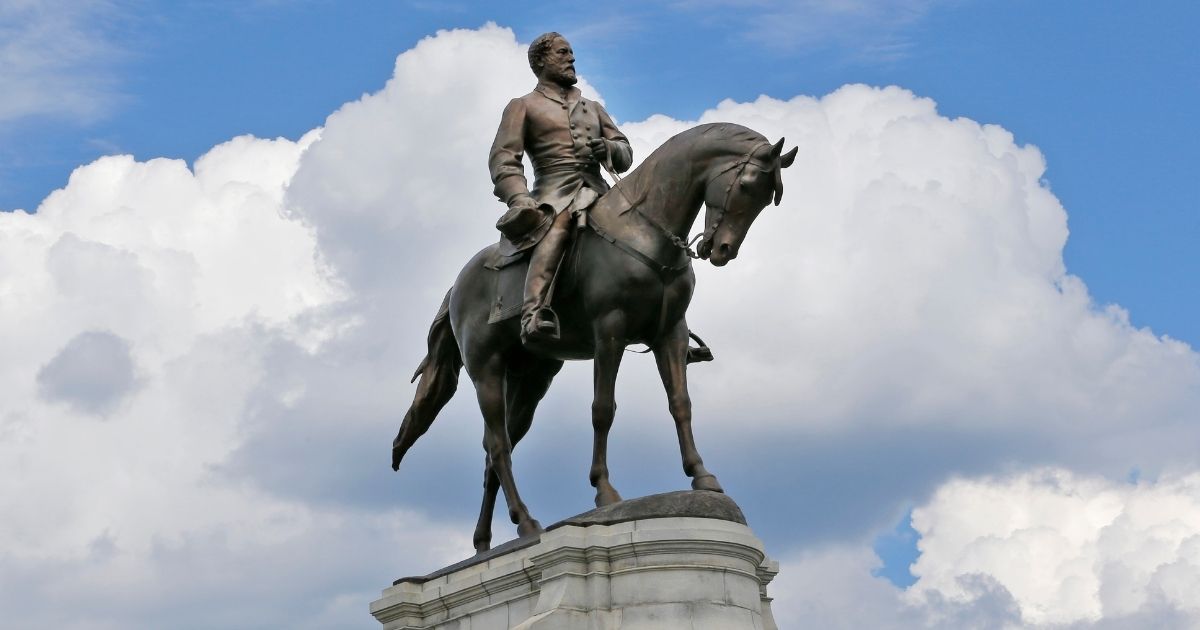 A statue of Confederate Gen. Robert E. Lee stands in the middle of a traffic circle on Monument Avenue in Richmond, Virginia.